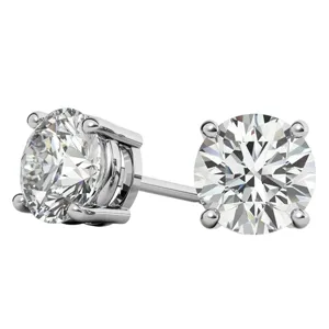 A pair of round, clear gemstone stud earrings set in a four-prong setting, likely made of silver or white gold.