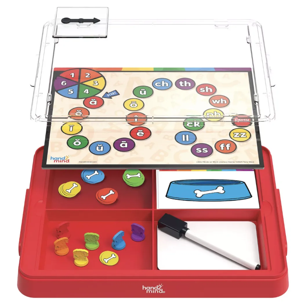 A hands-on educational kit by hand2mind featuring a literacy board game with colored bone tokens, a dry erase marker, and a phonics board with a spinner.