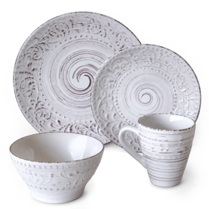 A 16-piece dinnerware set featuring a white glaze with embossed circular patterns, including dinner plates, salad plates, bowls, and mugs.