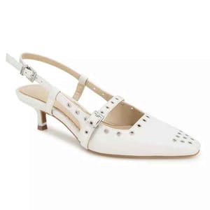 Kenneth Cole Eyelet Kitten Heel Pumps feature a sleek white design with eyelet details and dual straps with buckles, complemented by a small, elegant kitten heel.