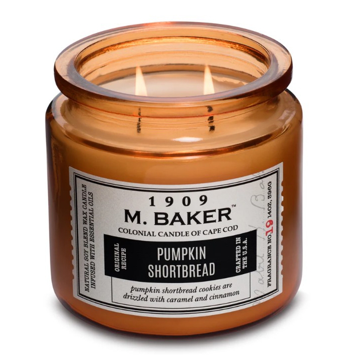 M. Baker candle, \“Pumpkin Shortbread\“ scent, 14 oz, features natural soy blend wax with essential oils, described as having notes of caramel and cinnamon.