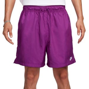 Purple Nike shorts with a drawstring waist and a small white logo on the left leg.