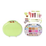 A green oval makeup case with a cherry design includes an extensive eyeshadow and blush palette, lip glosses, brushes, hair clips, and a heart-shaped accessory.