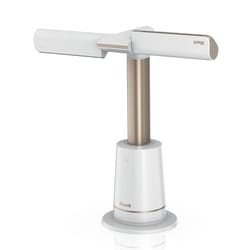 A Shark hand vacuum cleaner with a sleek design, featuring a white and gold color scheme and a vertical charging base.