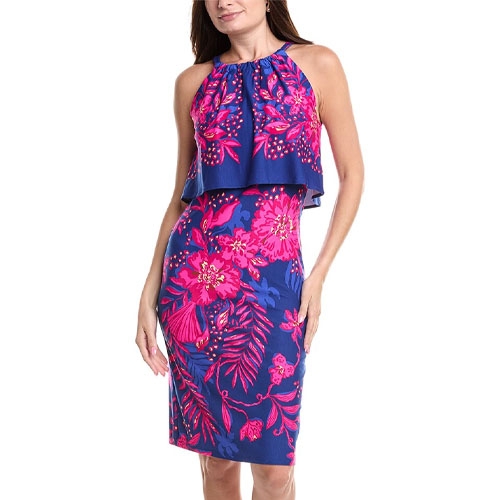 The Lilly Pulitzer Stella Mae Dress is a knee-length dress featuring a bright floral pattern in pink on a blue background. It has a halter neckline with a flowing overlay for a layered look.