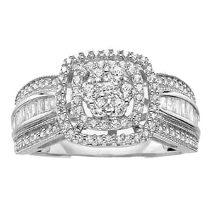 A silver ring with a cushion-shaped cluster of small round diamonds in the center, flanked by baguette-cut diamonds and additional rows of round diamonds on a split shank design.