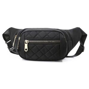 Quilted black waist bag with adjustable strap and multiple zippered compartments, featuring gold-tone zippers.