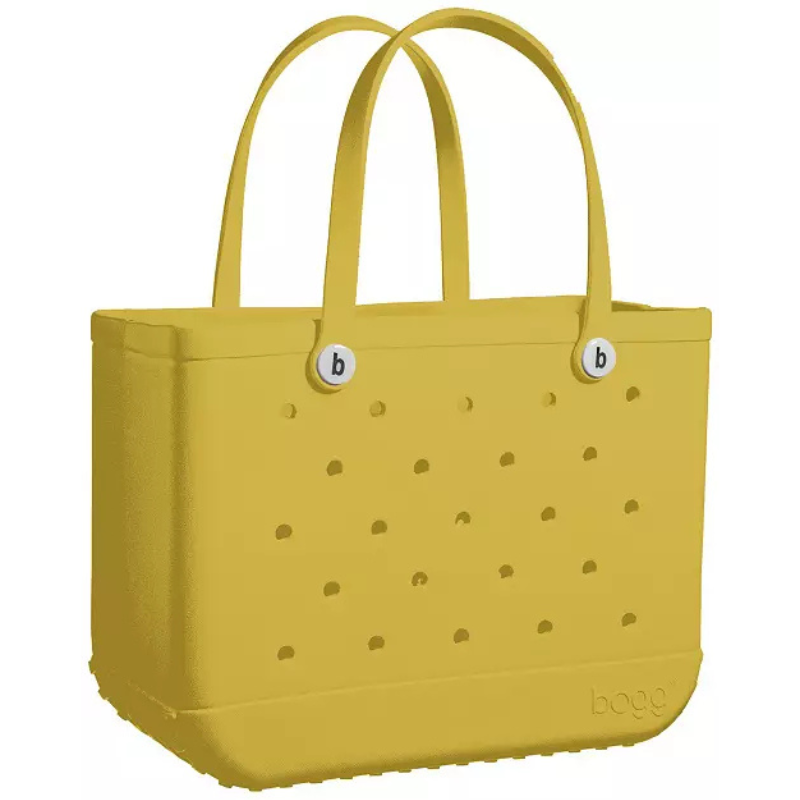Yellow tote bag with perforated sides, dual oval handles, and button embellishments featuring the letter \“b\“.