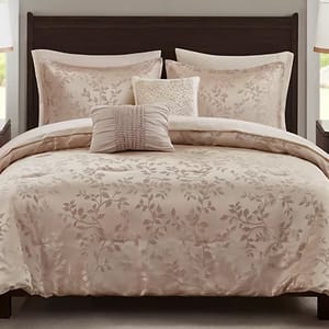A floral-patterned bedding set featuring a comforter, two large pillows, and two decorative throw pillows, all in a soft beige tone.