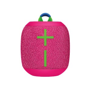 The Wonderboom 3 Speaker is a portable Bluetooth speaker in pink with a woven texture, featuring prominent green plus and minus symbols for volume control. It includes a blue and green loop handle for easy carrying.