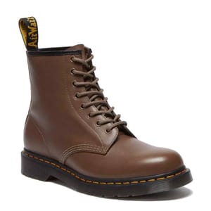 Brown lace-up boots with a rugged design, featuring a durable sole and classic yellow stitching. They have a black heel tab with yellow text, characteristic of the brand's style.