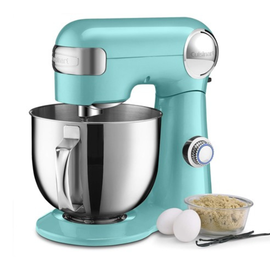 A teal Cuisinart stand mixer with a stainless steel bowl, a flat beater attachment, and additional ingredients displayed beside it.