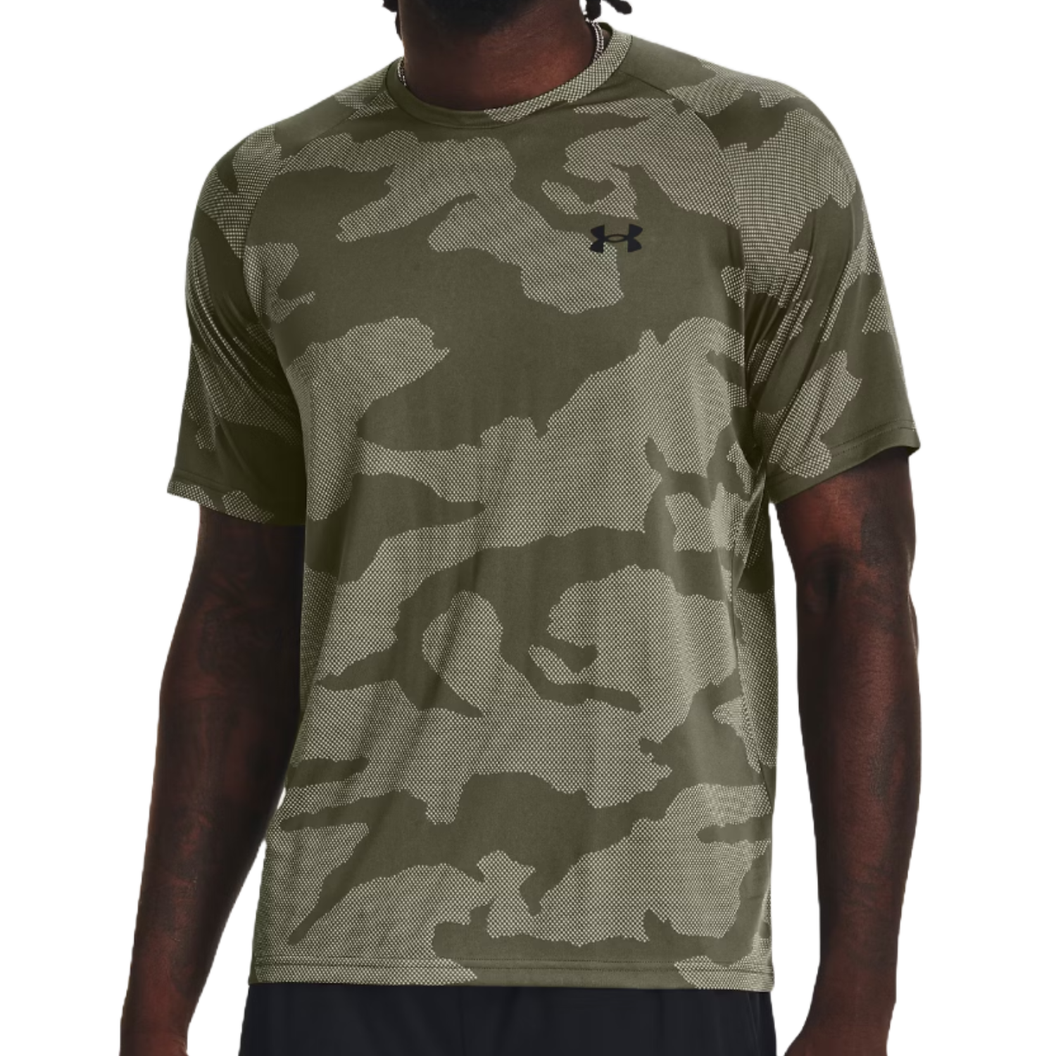 A man wearing a camouflage t-shirt with the Under Armour logo on the chest.