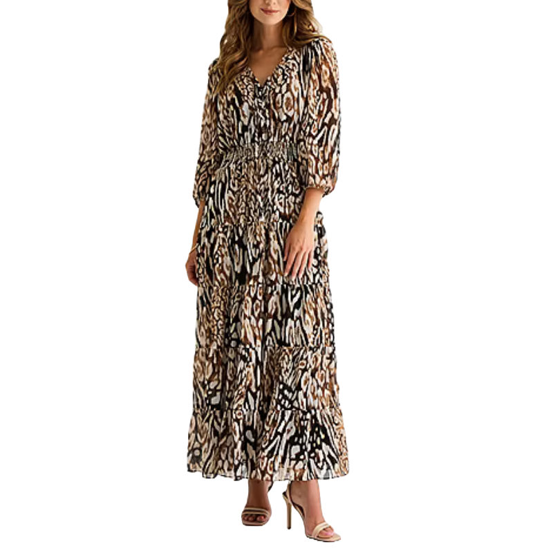 A woman is wearing a long, animal print maxi dress with three-quarter sleeves and a smocked waist, paired with high-heeled sandals.