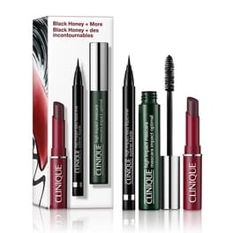 The Clinique Black Honey Gift Set includes a lipstick, liquid eyeliner, mascara, and an eye cream stick, all in black and green packaging.