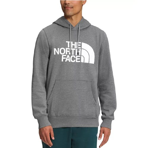 A man is wearing a gray hoodie with \“THE NORTH FACE\“ logo on the chest, featuring a front pocket and drawstring hood.