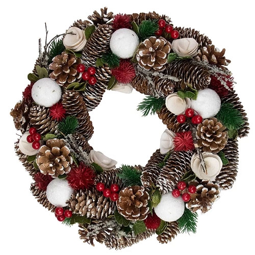A decorative wreath featuring pinecones, red and green foliage, white balls, and red berries, with natural and snowy accents for a festive look.