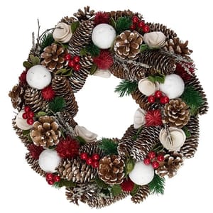 A decorative wreath featuring pinecones, red and green foliage, white balls, and red berries, with natural and snowy accents for a festive look.