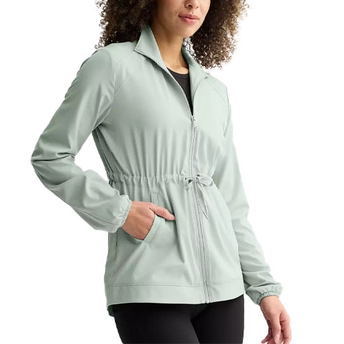 A light gray zip-up jacket with a drawstring waist and side pockets, worn by a person in black pants.