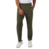Olive green jogger pants, featuring an elastic waistband, paired with white sneakers.