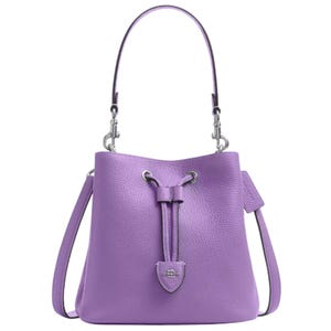 Lilac leather bucket bag with a drawstring closure, featuring silver hardware and both a top handle and a detachable shoulder strap.