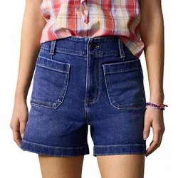 High-waisted denim shorts with large front pockets and a button closure, paired with a plaid shirt.