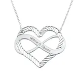 A silver heart-shaped pendant with an infinity symbol design, featuring the engraved names \“Grace & Oscar,\“ attached to a delicate chain.
