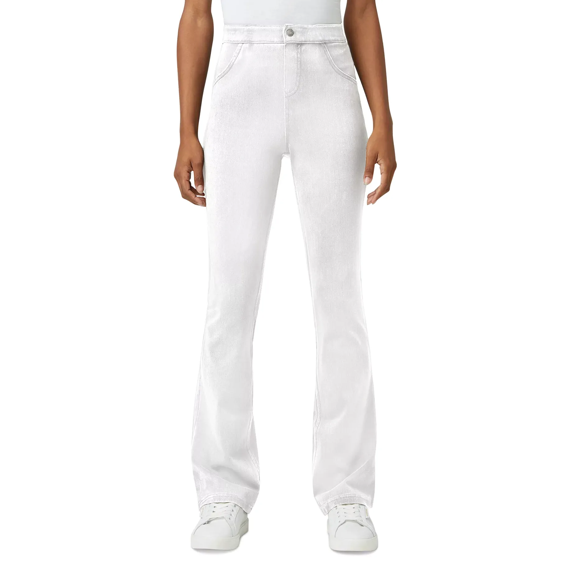 White high-waisted, flare-leg pants paired with white sneakers, worn by a standing person.
