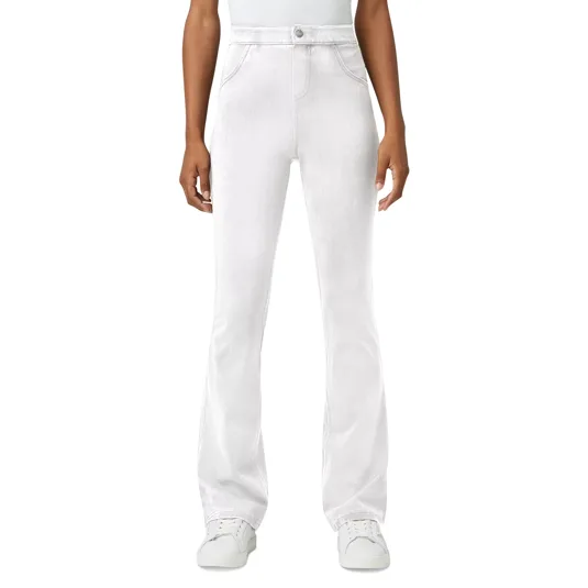 White high-waisted, flare-leg pants paired with white sneakers, worn by a standing person.