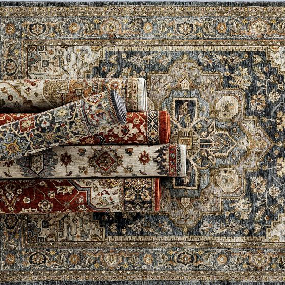 A collection of rolled decorative Persian-style rugs with intricate patterns in warm and neutral colors, displayed on a larger, similarly patterned rug background.