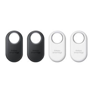 Four Samsung SmartTag2 trackers are shown, two in black and two in white, each with a hole at the top for attachment to objects.