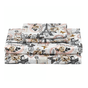 A set of bed sheets featuring a Paris-themed design, including the Eiffel Tower, roses, and Parisian motifs, in a mix of pink, beige, and black colors.