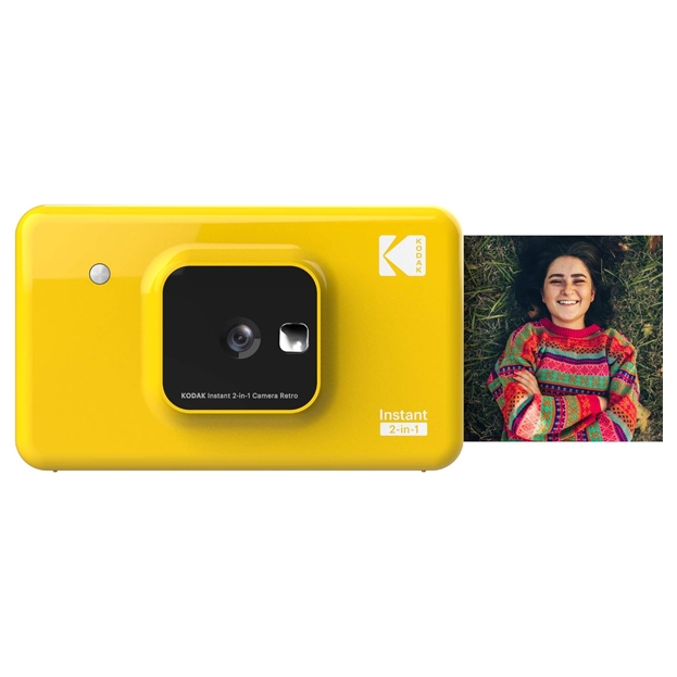 Yellow Kodak Mini Shot 2 Instant Camera featuring a 2-in-1 design for capturing and printing photos. It includes an example print showing a person smiling in a colorful sweater.
