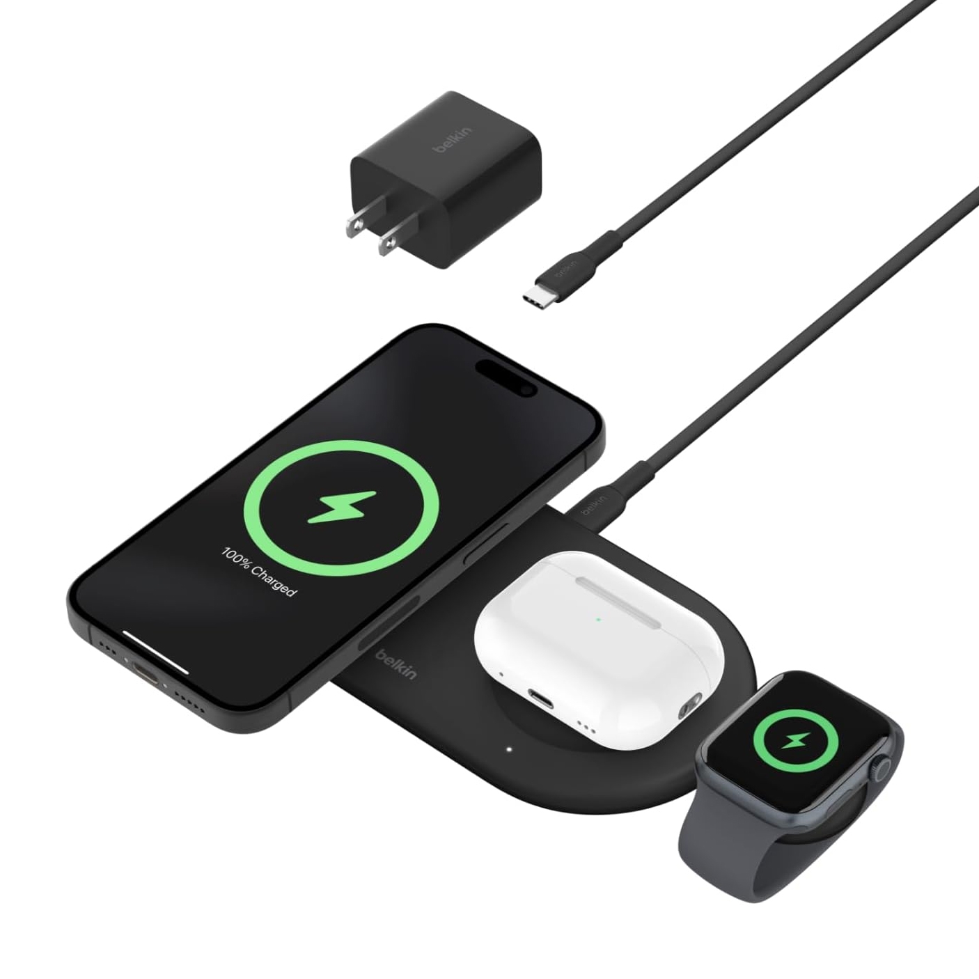 A wireless charging pad with an Apple smartphone, AirPods, and smartwatch charging simultaneously, accompanied by a wall charger and a USB-C cable.