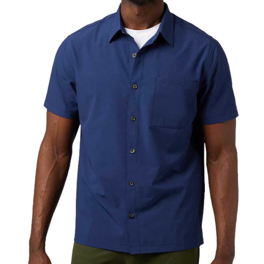 A man wearing a navy blue short-sleeve button-up shirt with a single chest pocket, layered over a white undershirt.