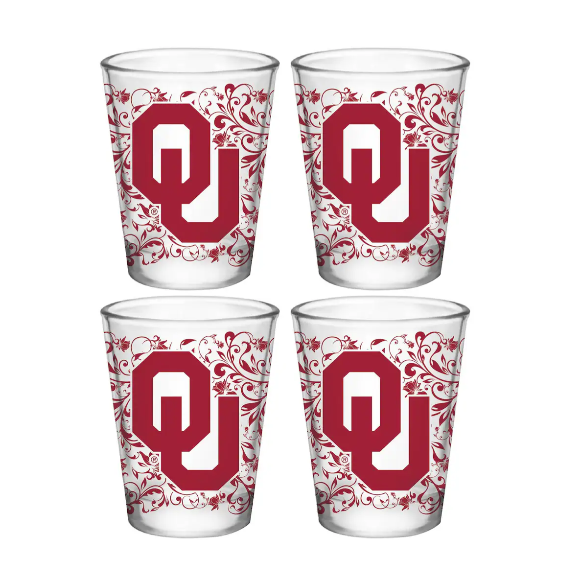 Four shot glasses featuring a decorative design with the \“OU\“ logo in red, indicative of the University of Oklahoma.