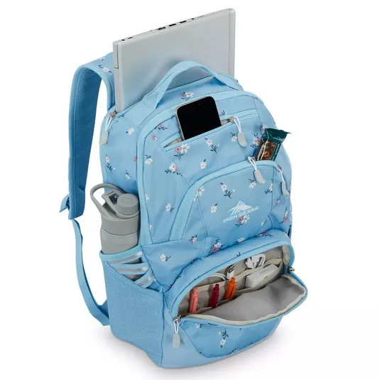 A light blue floral backpack featuring a padded compartment for a laptop, front pocket for a smartphone, snack pocket, organizer pocket with pens, and mesh side pocket with a water bottle.