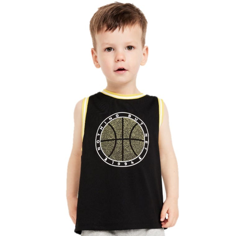 A young child is wearing a black basketball jersey with yellow trim, featuring a graphic of a basketball and the text \“Nothing But Net 1994.\“