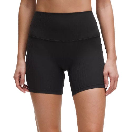 A person is wearing black high-waisted, stretchy biker shorts.