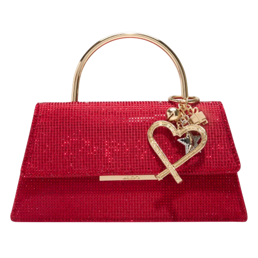 A red handbag adorned with sparkling sequins and a gold-tone handle, featuring a heart-shaped charm and other decorative elements hanging from it.
