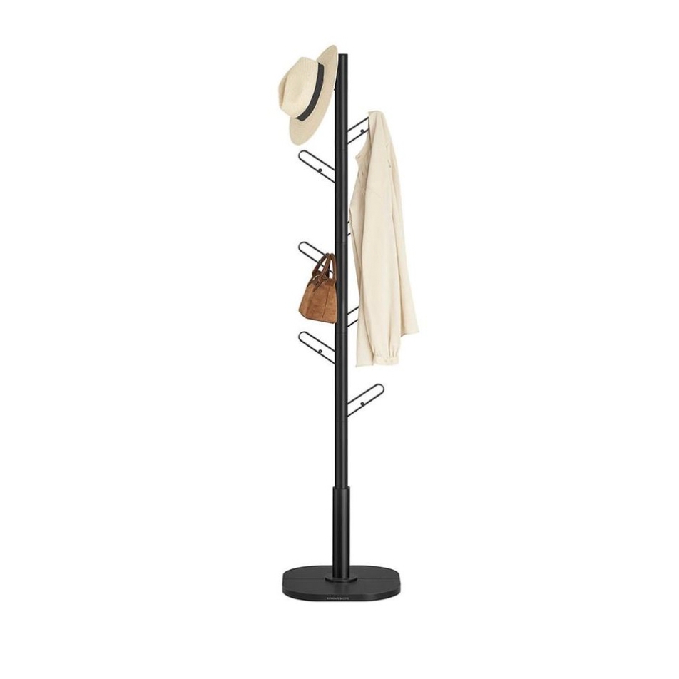 Black metal coat rack with eight staggered hooks, featuring a hat, beige jacket, and brown bag for storage and organization.