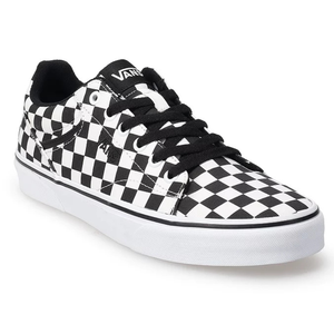 Black and white checkerboard-patterned Vans sneakers with black laces, a low-top design, and white rubber soles. The brand logo is visible on the tongue.