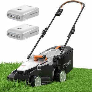 A cordless lawn mower with a folding handle and two rechargeable batteries is shown on grass.