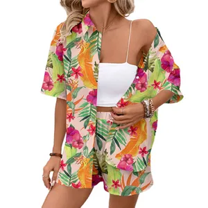 A woman wears a colorful floral two-piece matching set with shorts and an open button-up shirt over a white tank top.