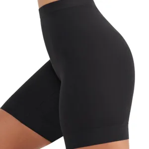 Black high-waisted biker shorts designed for a snug fit, shown on a model's side profile.