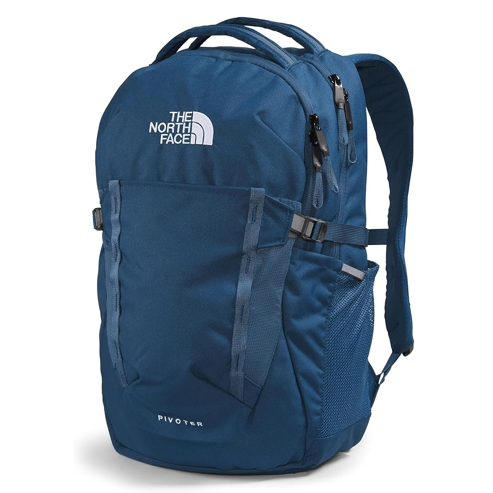 A blue North Face Pivoter backpack with adjustable straps and multiple compartments.