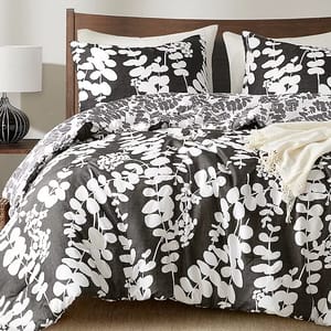 3pc Reversible Queen Comforter Set with a bold gray and white leaf pattern; includes a comforter and two pillow shams. The design is modern with a natural theme, suitable for a contemporary bedroom look.
