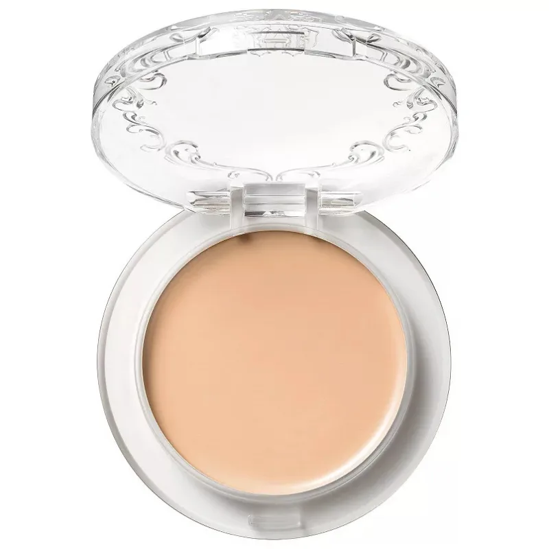The KVD Beauty Full-Coverage Foundation is a cream foundation in a compact with a clear, decorative lid. It provides full coverage and is designed for smooth application.