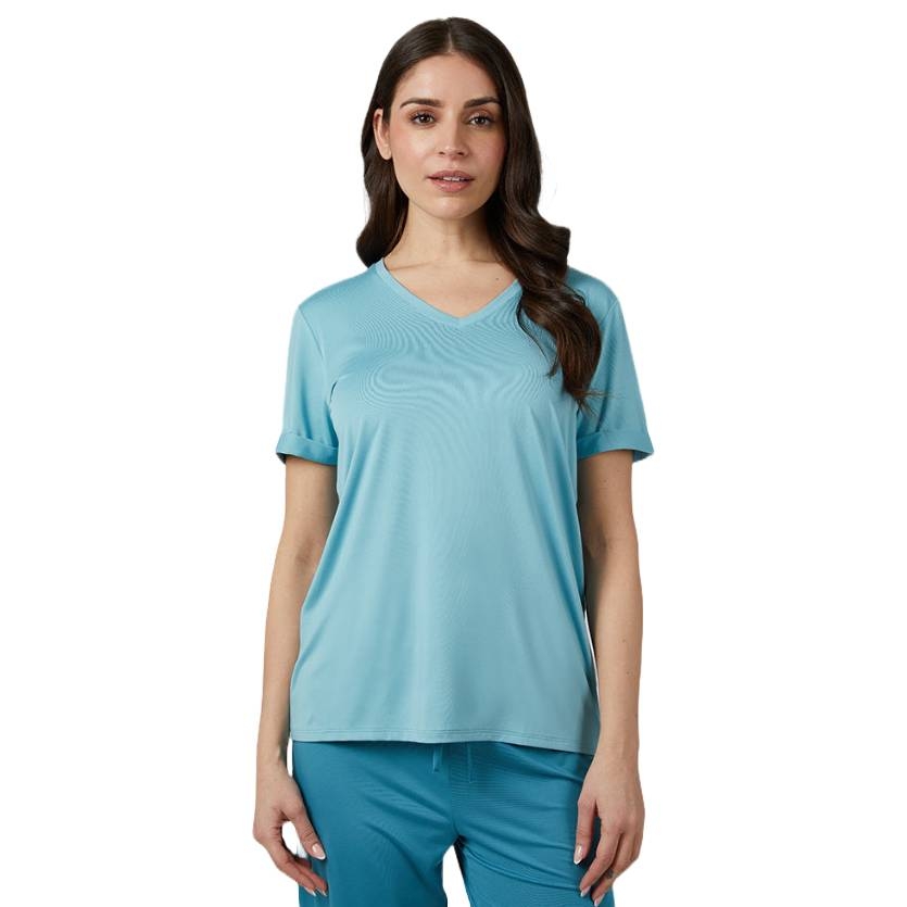 A woman is wearing a light blue V-neck short-sleeve sleep tee paired with matching pants. The shirt has a relaxed fit, suitable for comfortable sleepwear.