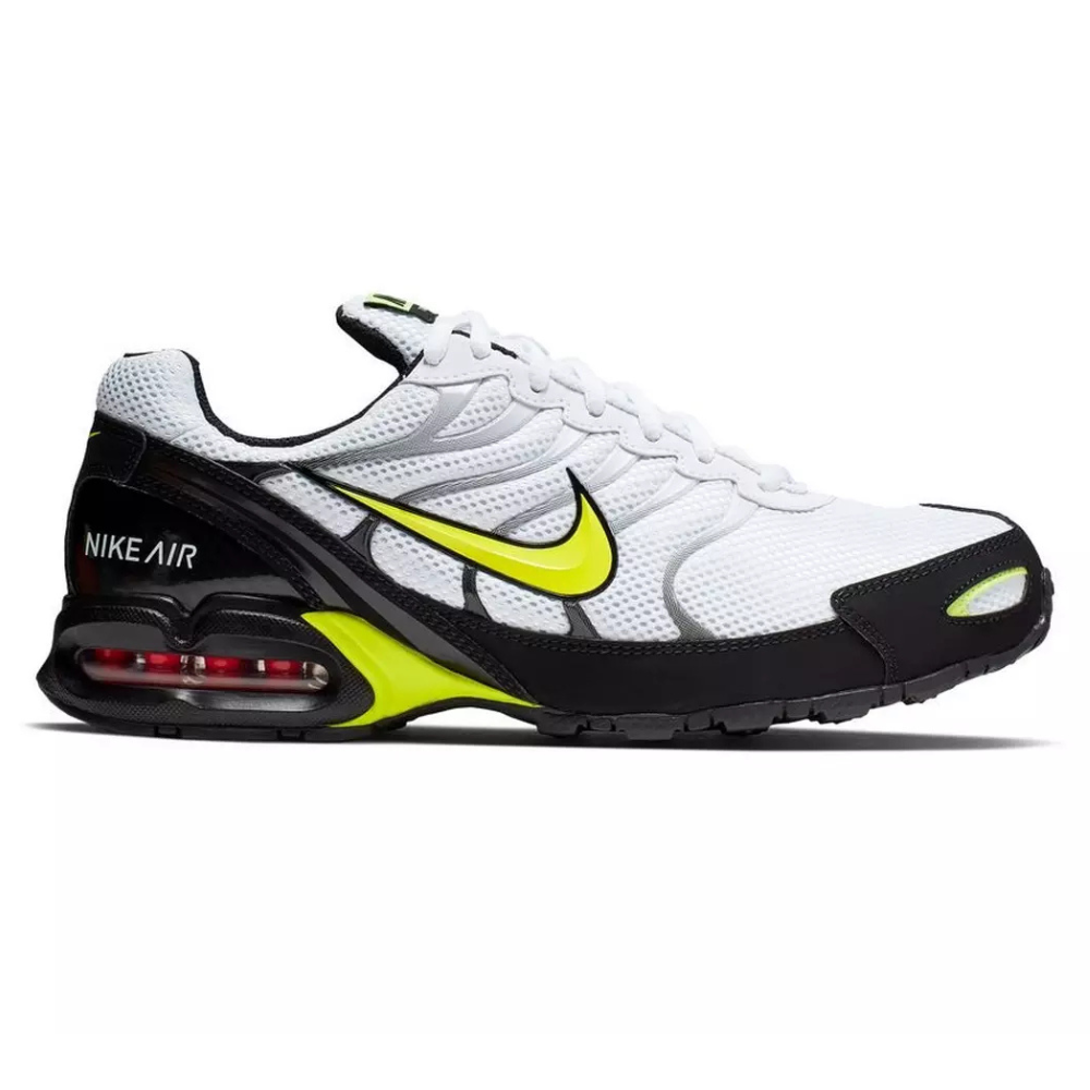 Nike Air Max Triax 96 sneaker in white, black, and neon yellow featuring a visible air cushion in the heel and mesh upper with synthetic overlays.